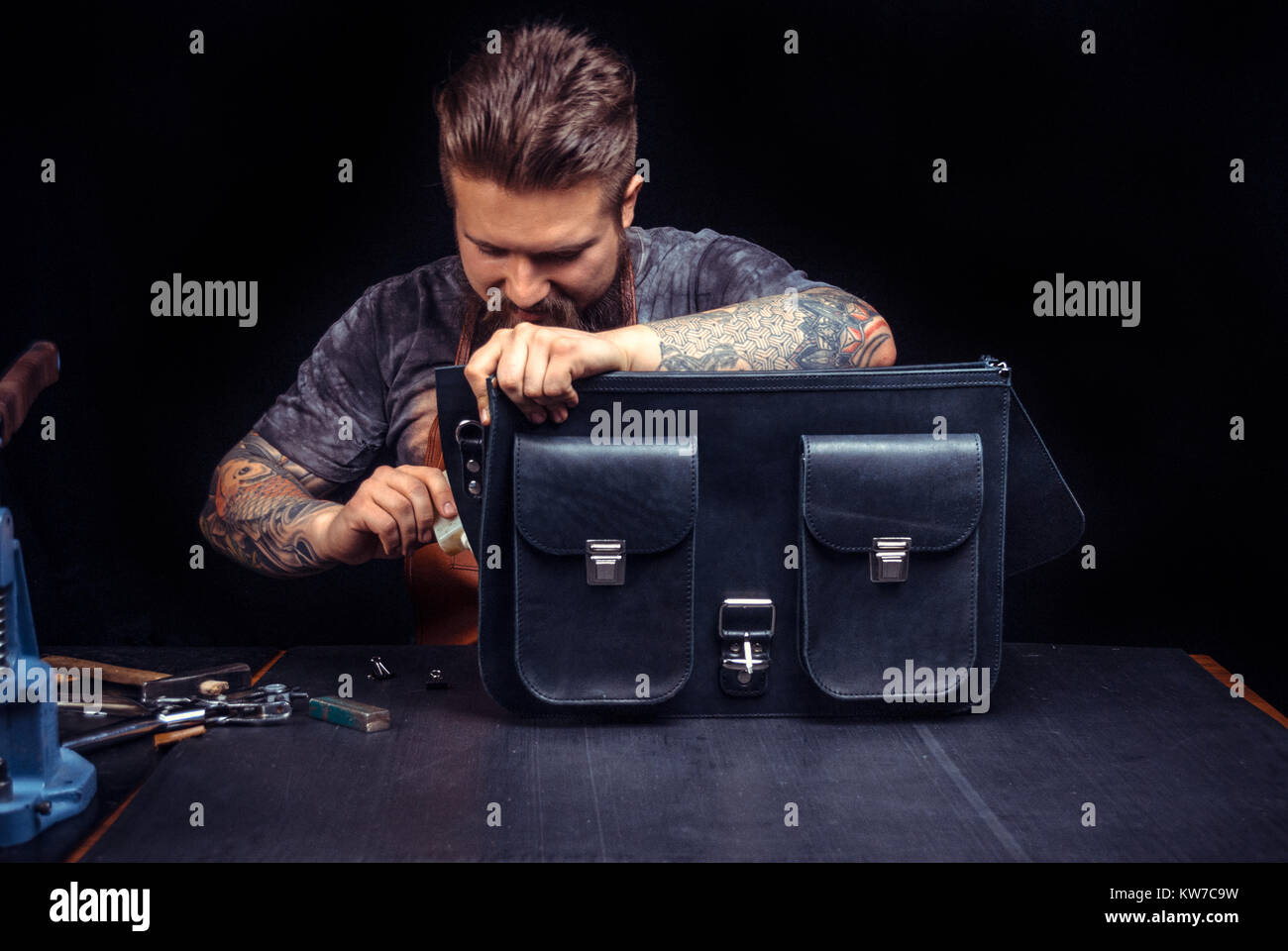Caucasian young artisan making leather briefcase Stock Photo Alamy