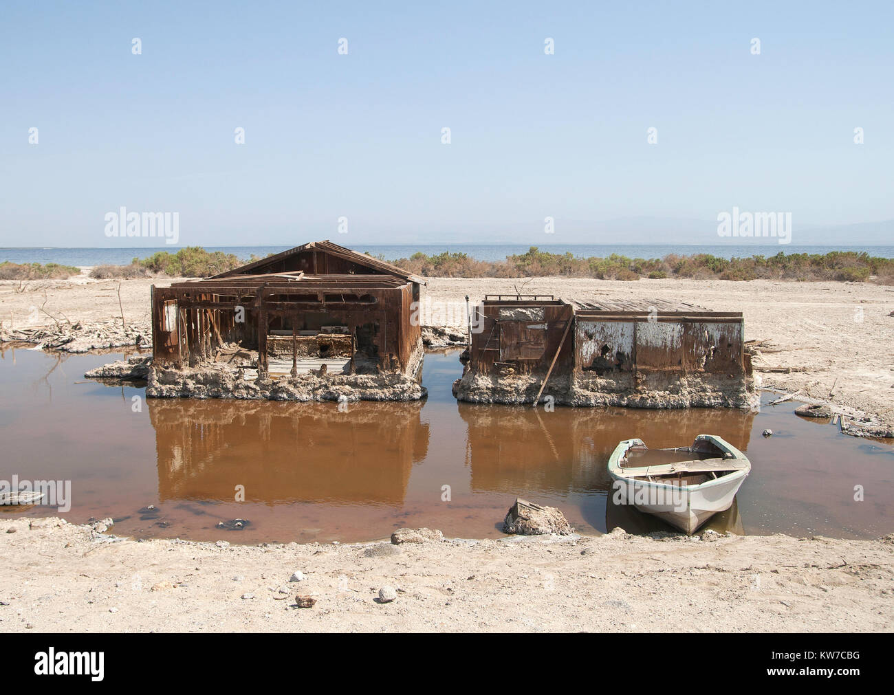 Torn and abandoned houses in water in Salton Sea Beach, California, USA. This site does no longer exist. Stock Photo