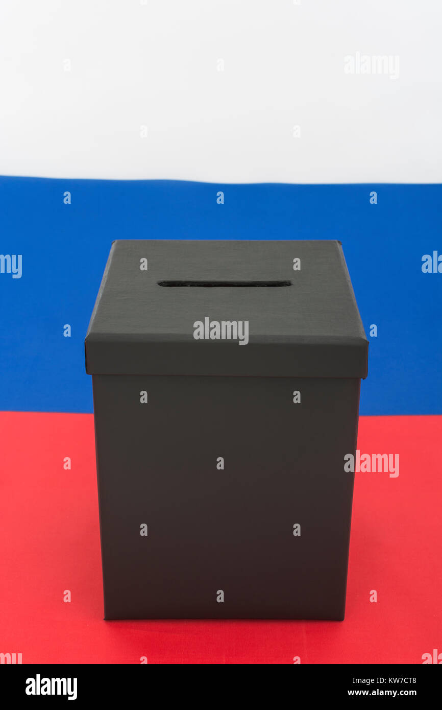 2024 Russian / fixed Russia elections concept - mock ballot box and Russian Federation flag - with copy space. Putin's rigged elections. Stock Photo