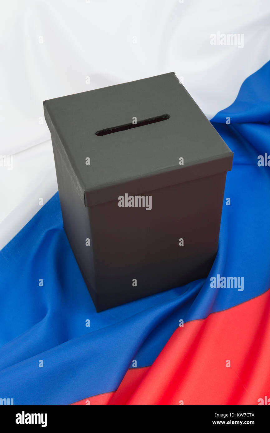 2024 Russian / fixed Russia elections concept - mock ballot box and Russian Federation flag - with copy space. Putin's rigged elections. Stock Photo