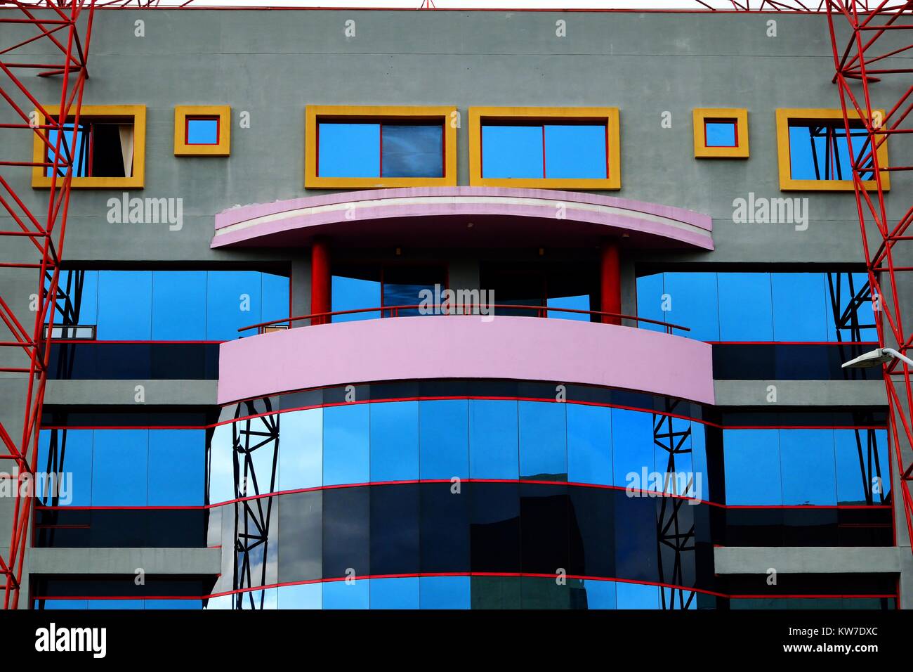 Colourful building facade with windows and balcony Stock Photo - Alamy
