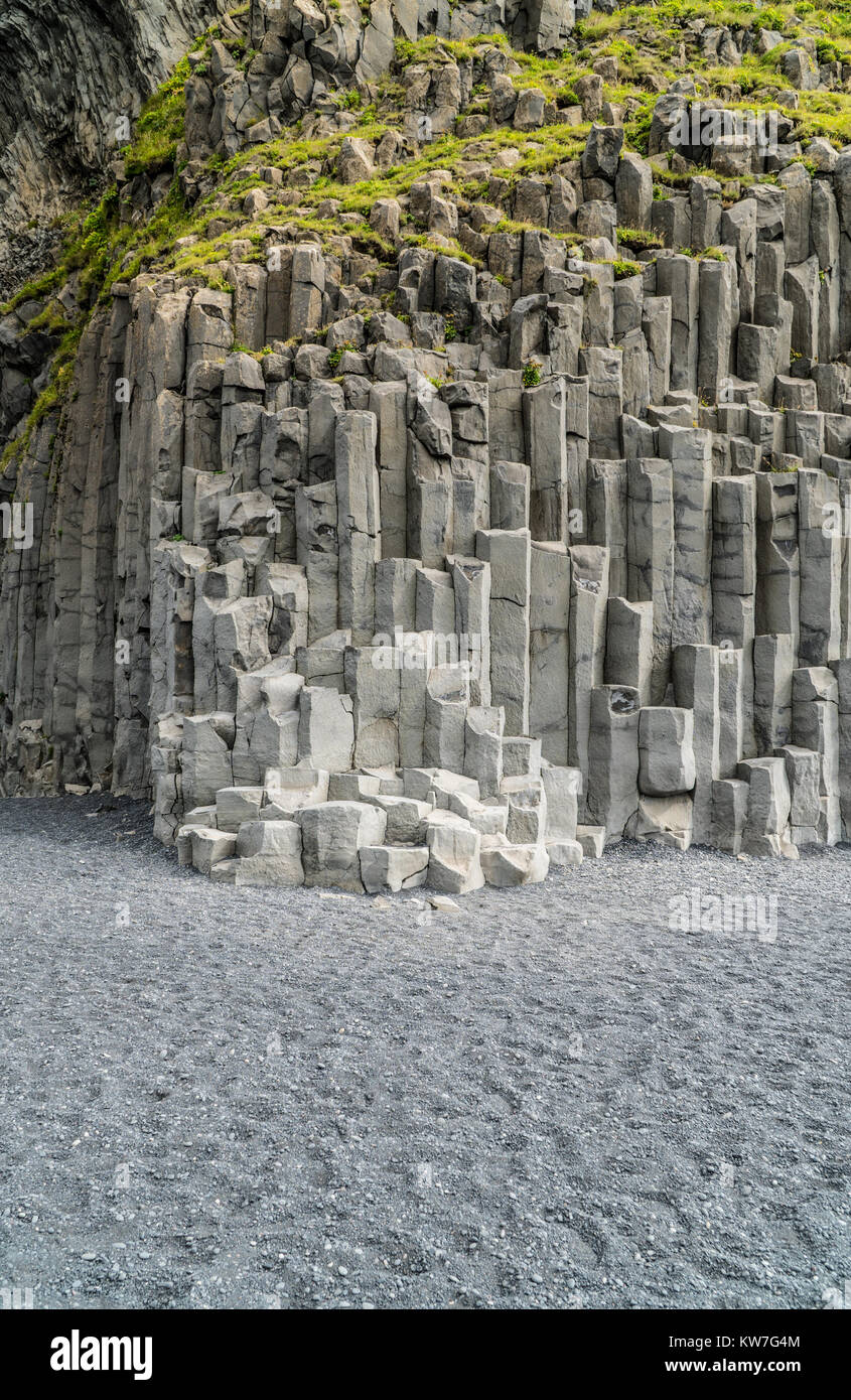 Grey basalt columns of varying height and thickness and depth, near Vik in south Iceland. Stock Photo