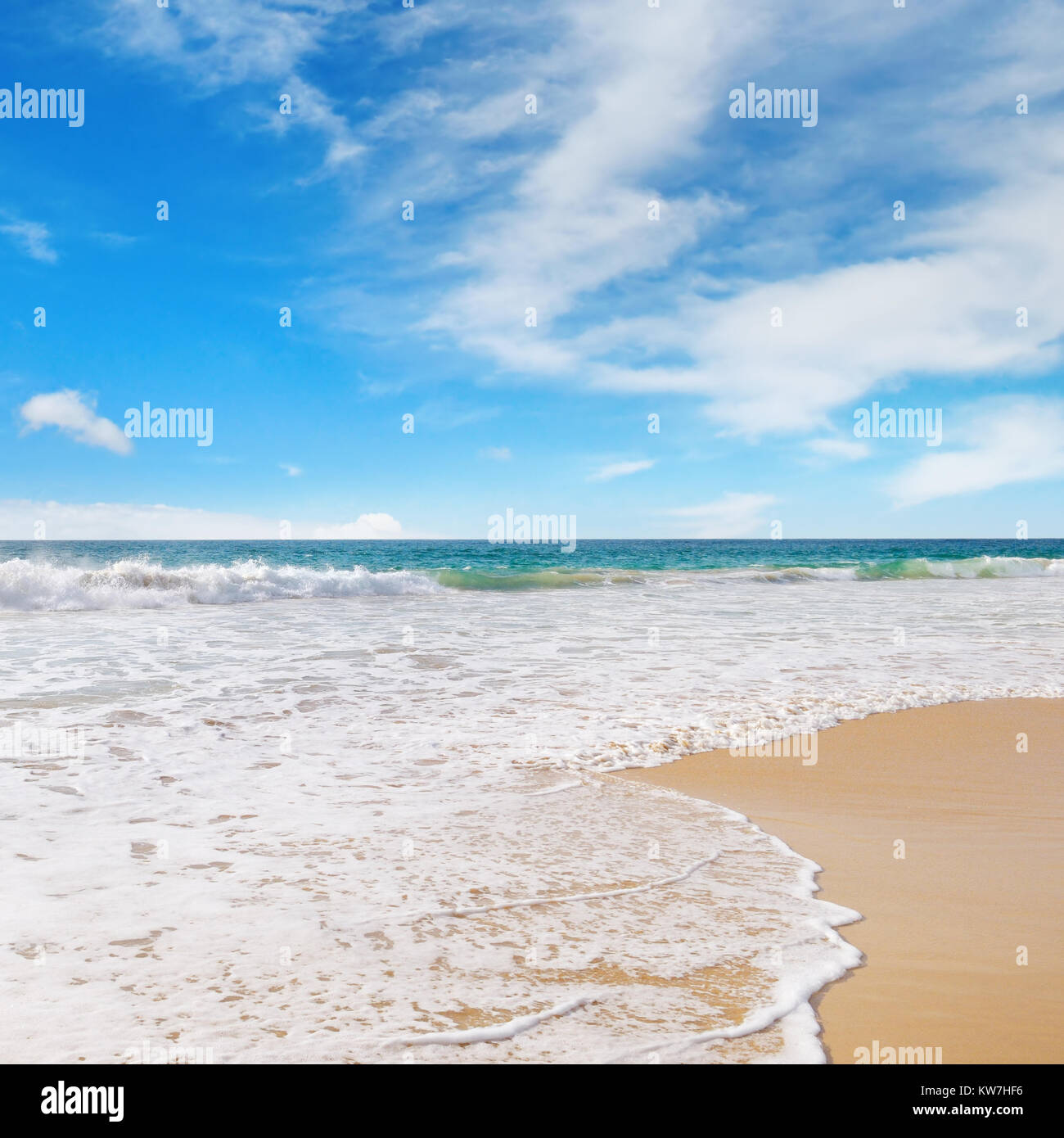 ocean, sandy beach and blue sky Stock Photo - Alamy