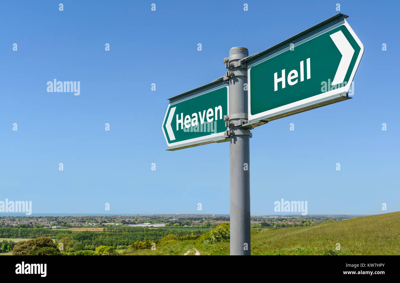 Heaven or hell concept direction sign. Go to heaven or go to hell concept signpost. Stock Photo