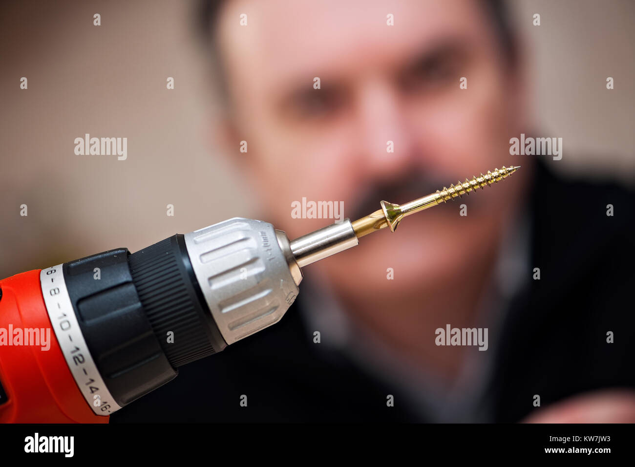 Electric screwdriver with screw Stock Photo Alamy