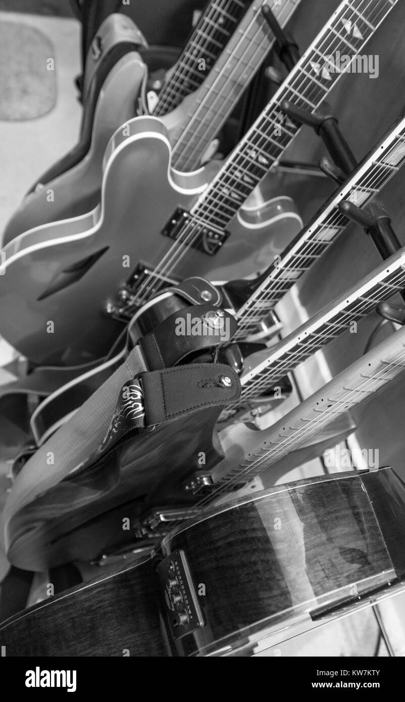 black and white detail image of a group of electric guitars Stock Photo
