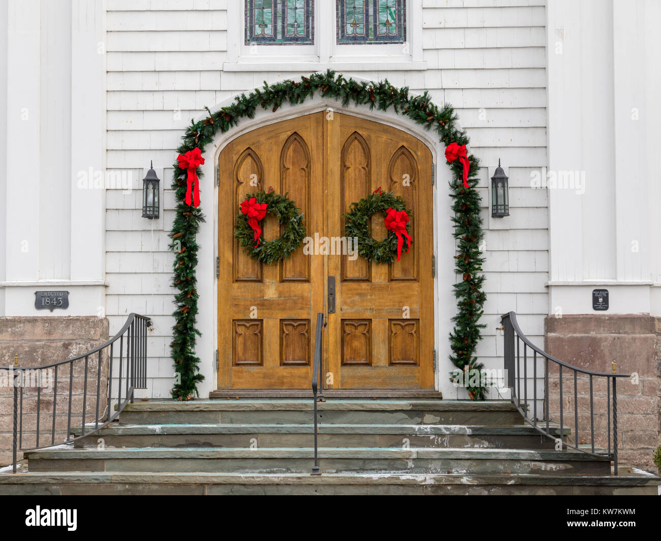 wooden front doors of a southampton church decorarted for Christmas Stock Photo