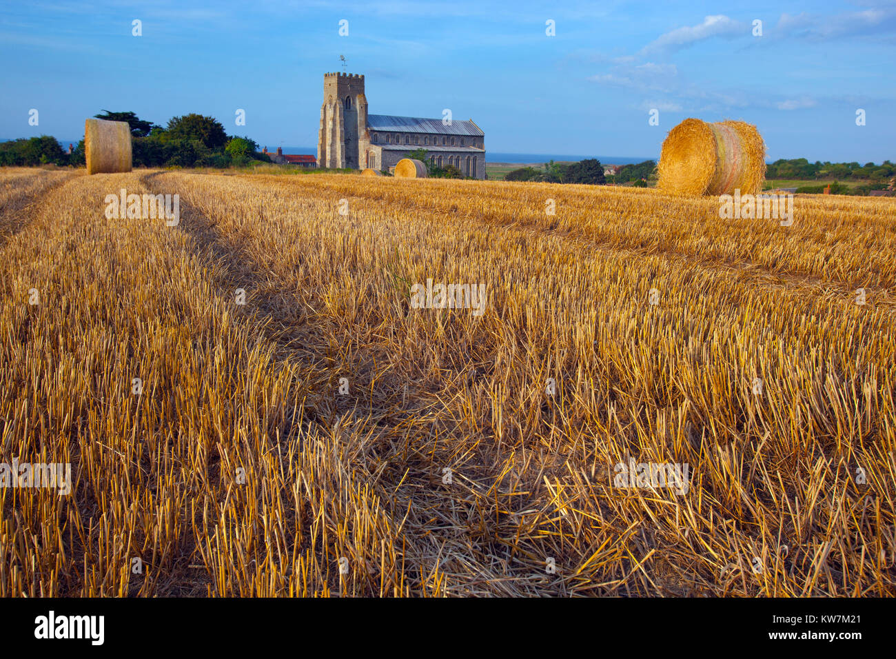 Salthouse Church Stubble and Bales after Harvest Norfolk August Stock Photo