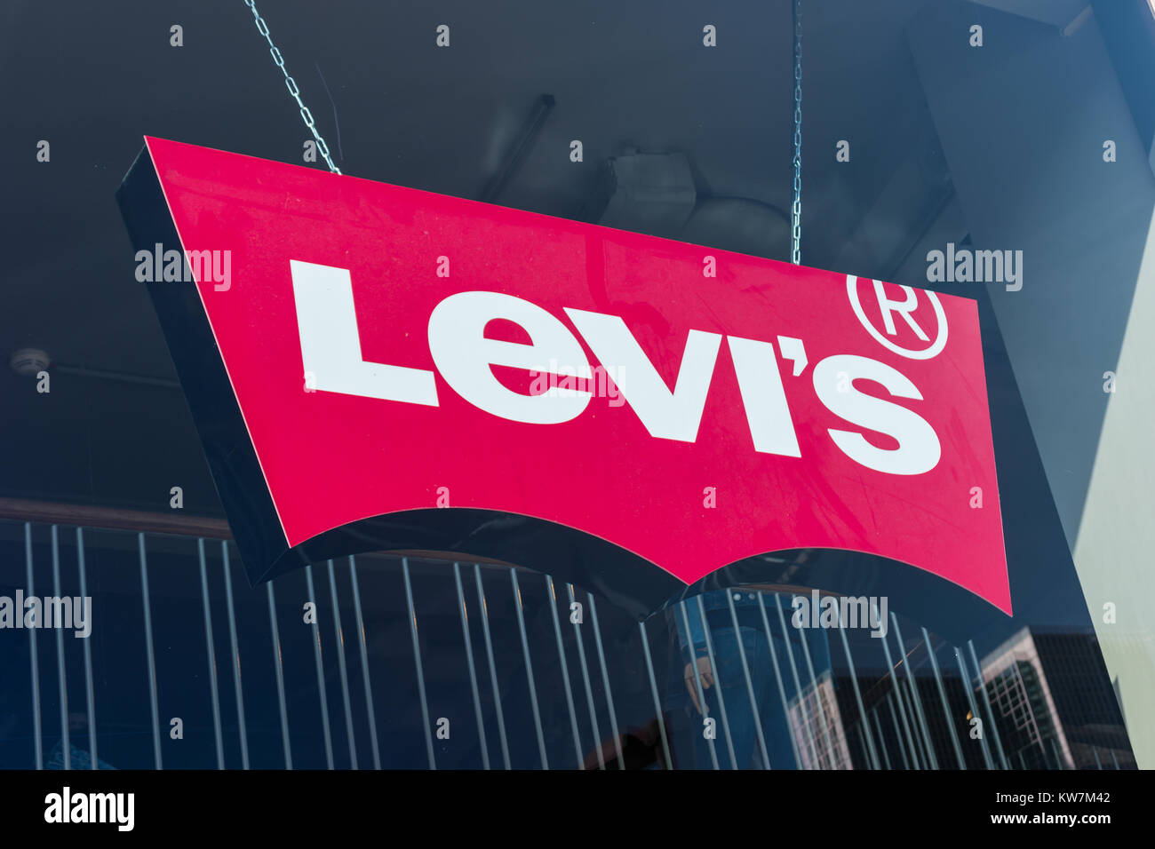 Levi's Store Logo behind a store window. Founded in 1853, Levi Strauss is  an American clothing company known worldwide for its brand of denim jeans  Stock Photo - Alamy