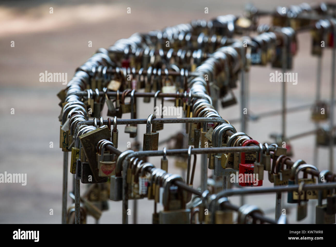 Padlocks on railings round a statue to St Valentin in Almeria, Andalucia, Spain Stock Photo