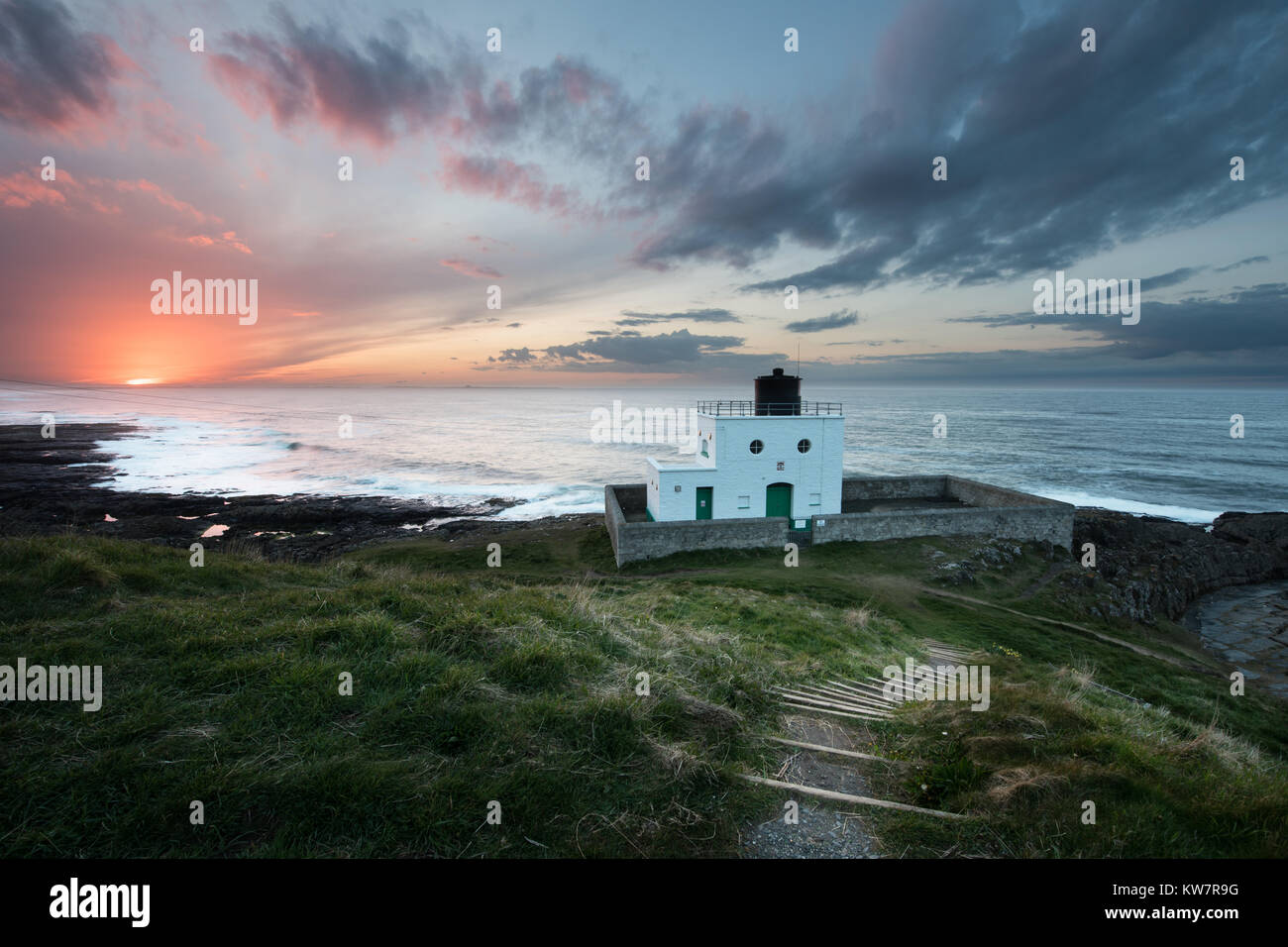 Sunset at Bamburgh Lighthouse Northumberland Stock Photo