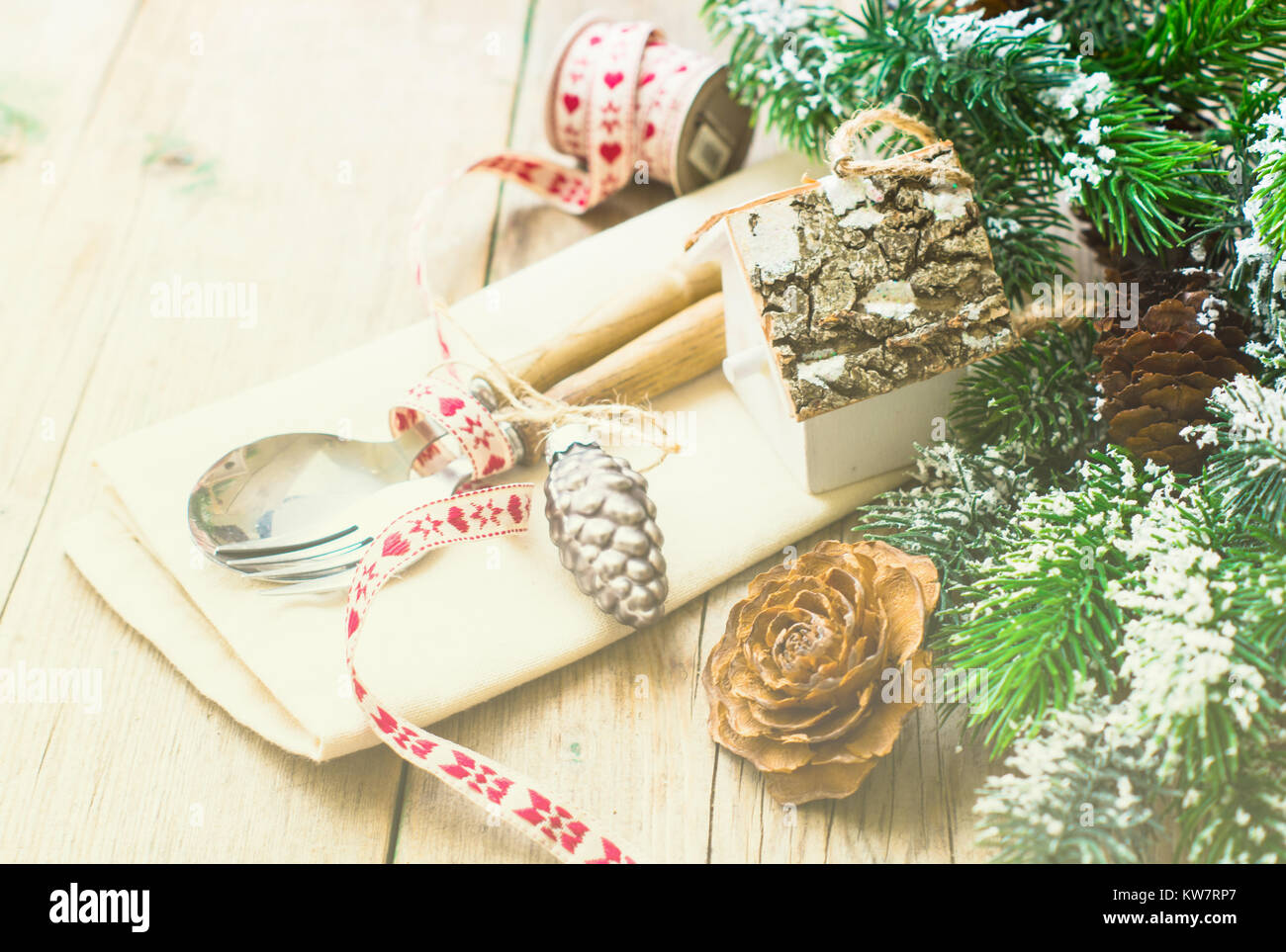 Silverware Pine Tree Pattern Christmas table setting with vintage silverware and pine tree branch in ...