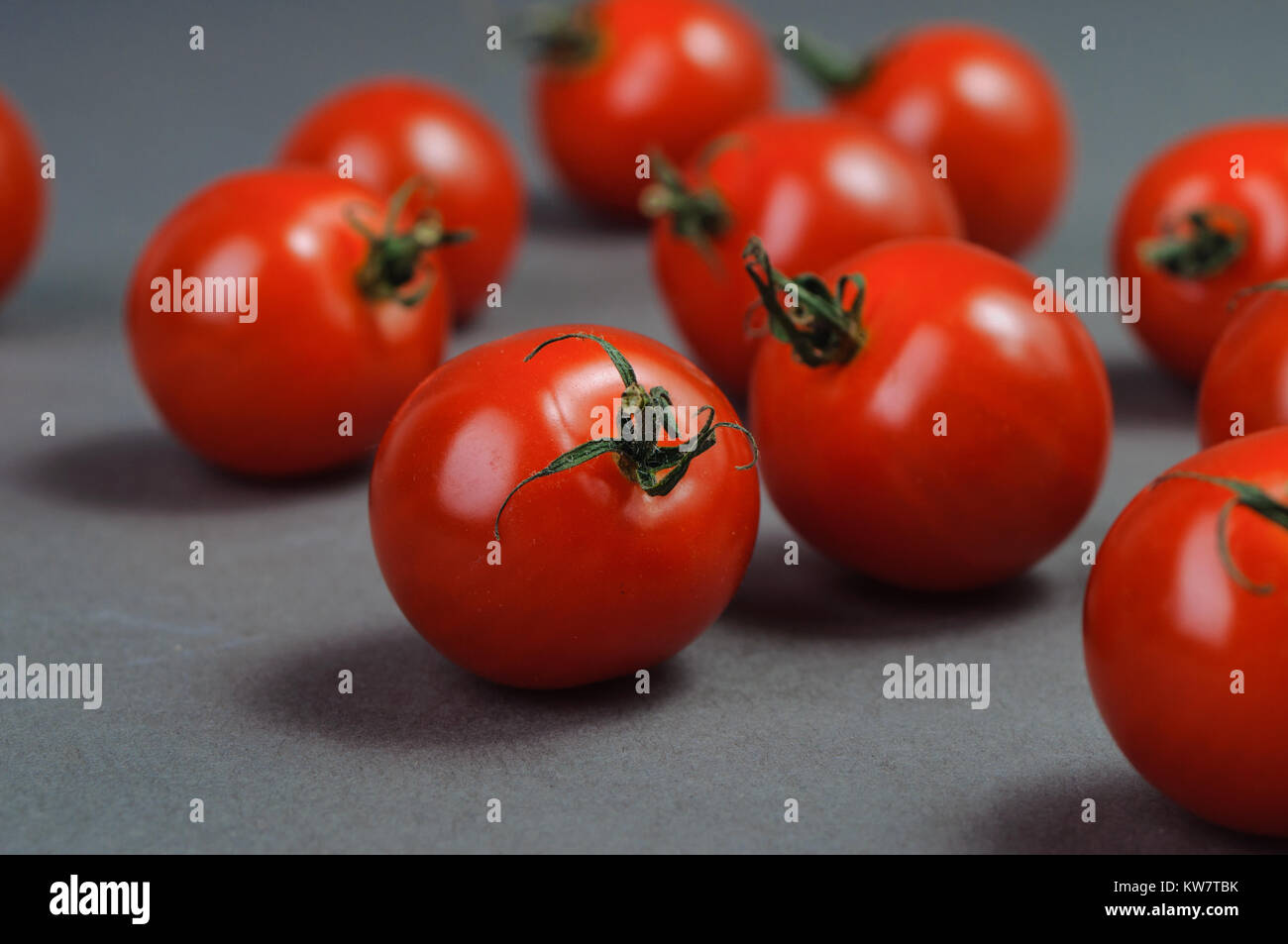 Group of red tomatoes Stock Photo - Alamy