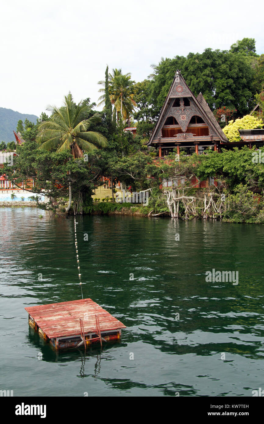 Raft and Samosir island on lake Toba, Indonesia Stock Photo