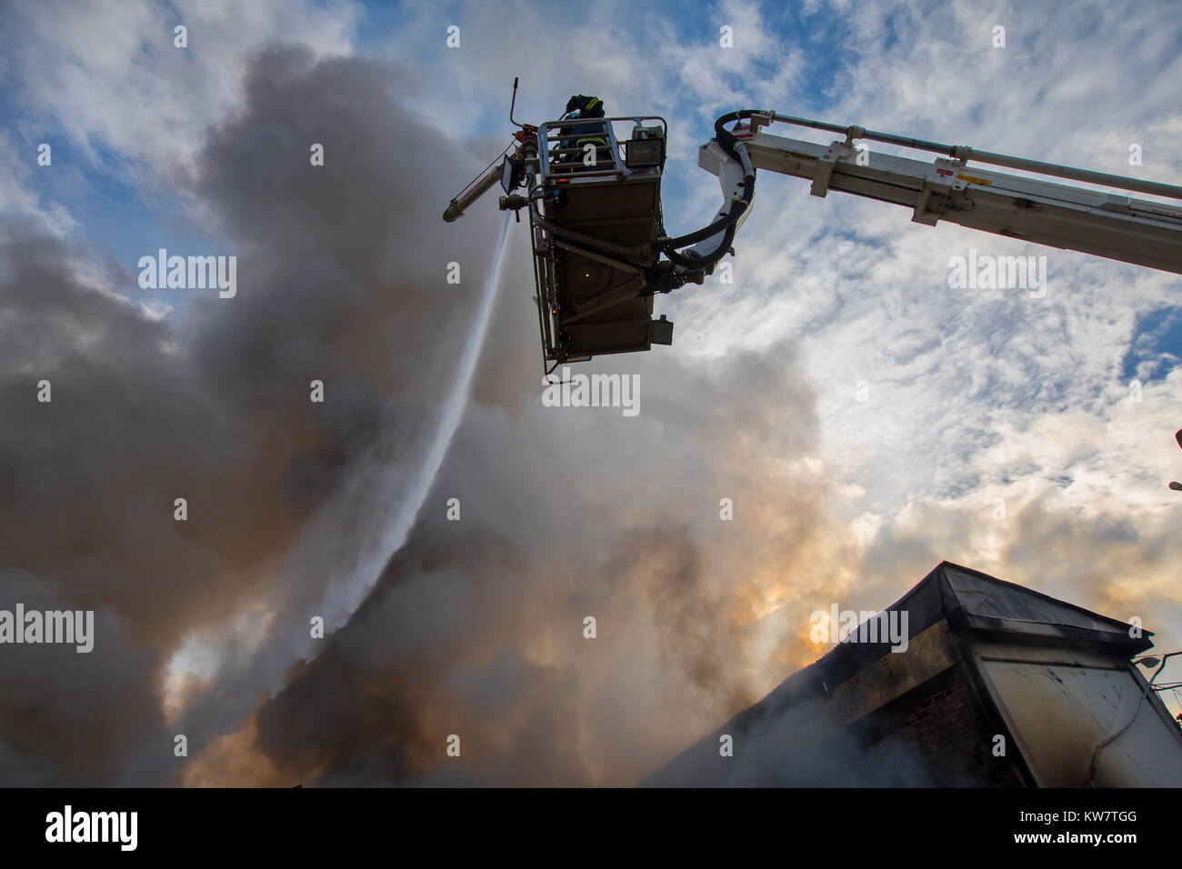 Sindos, Tessaloniki, Greece - December 29, 2017: Firefighters struggle to extinguish the fire that broke out at in a furniture factory in the industri Stock Photo