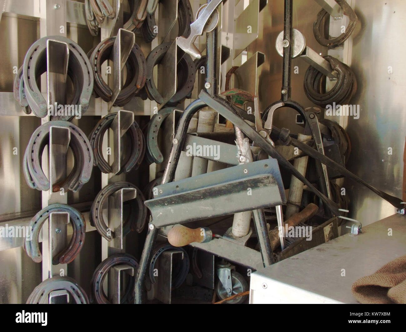 Farrier equipment on racks in a specialized truck. Stock Photo