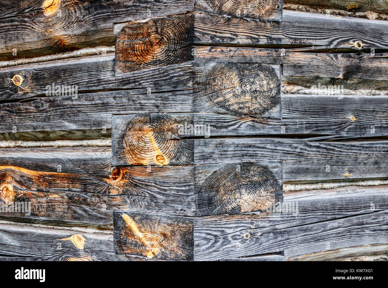 Corner of a wooden building constructed by joining the logs with oblique halving joints or oblique half lap joints. Stock Photo