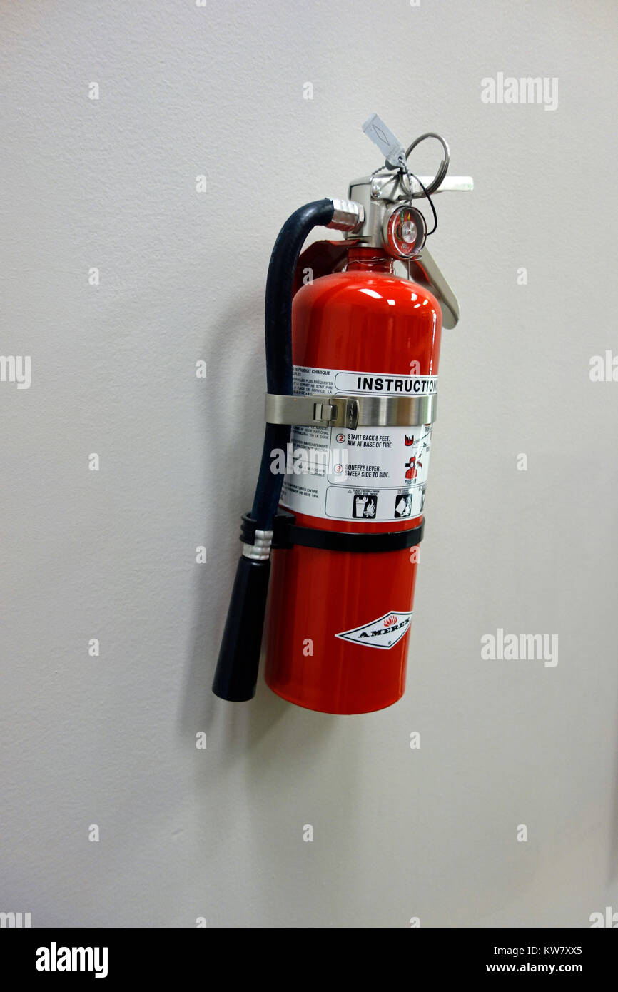A fire extinguisher on a wall Stock Photo Alamy