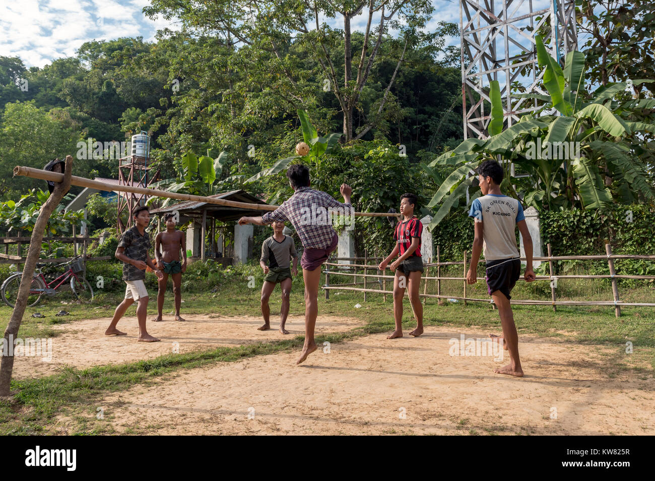 Villagers play a game of Sepak Takraw in Mrauk U, Burma (Myanmar) Stock Photo