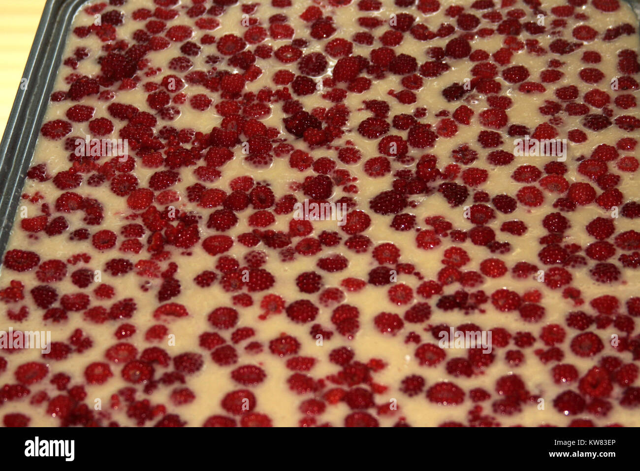 Raspberry cake before being baked Stock Photo
