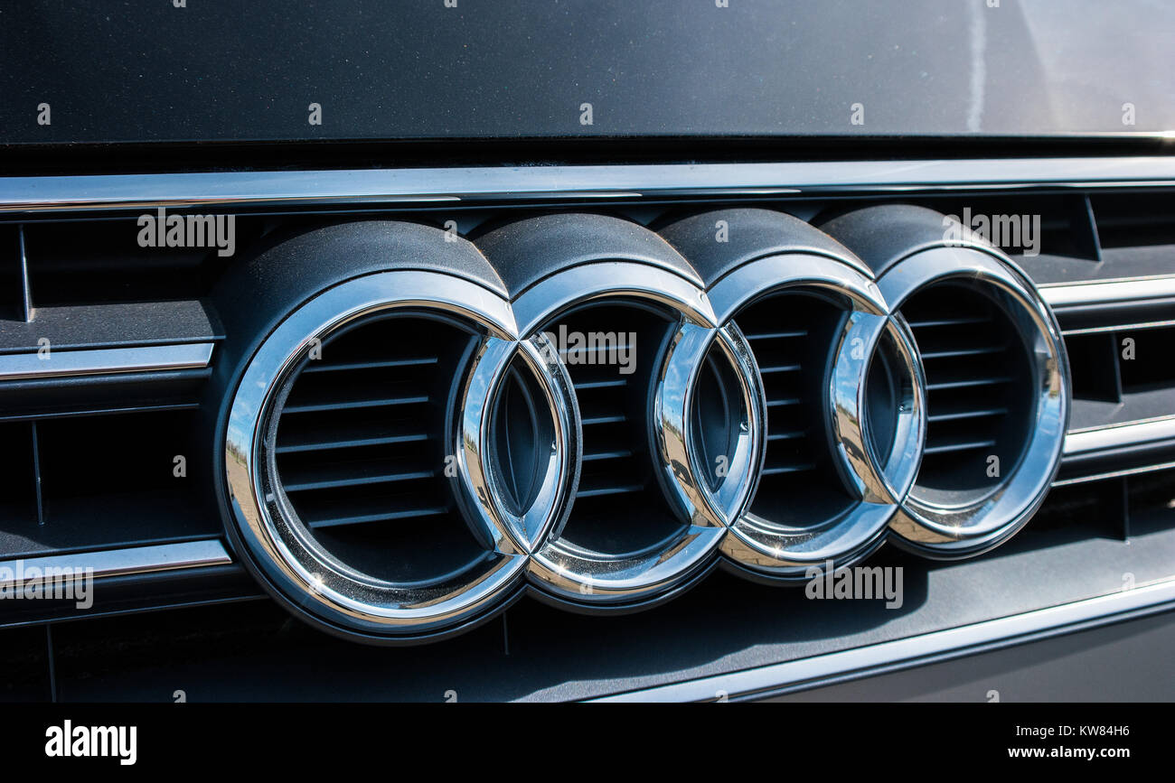 Audi emblem on a car grill. Audi is a German automobile manufacturer
