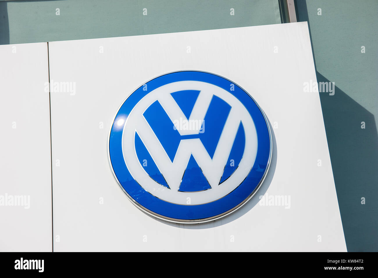 Volkswagen VW sign on a store facade. Volkswagen is a famous European car manufacturer company based on Germany. Stock Photo
