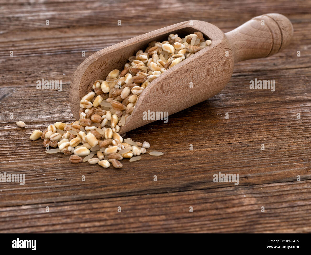 Healthy food option. Multigrain. With wooden scoop. Spelt, barley, oats and rice. Stock Photo