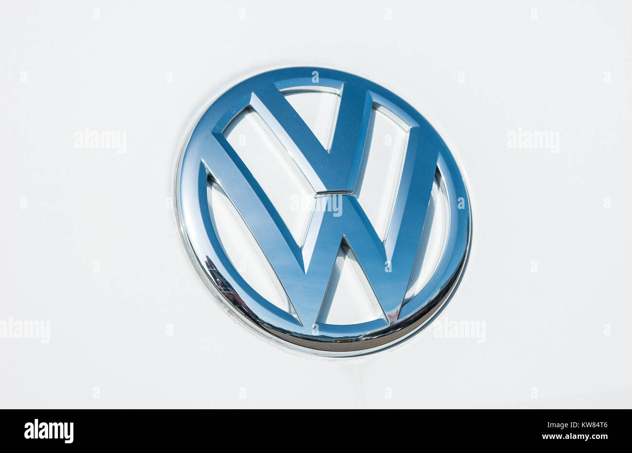 Volkswagen VW logo on a white car. Volkswagen is a famous European car manufacturer company based on Germany. Stock Photo