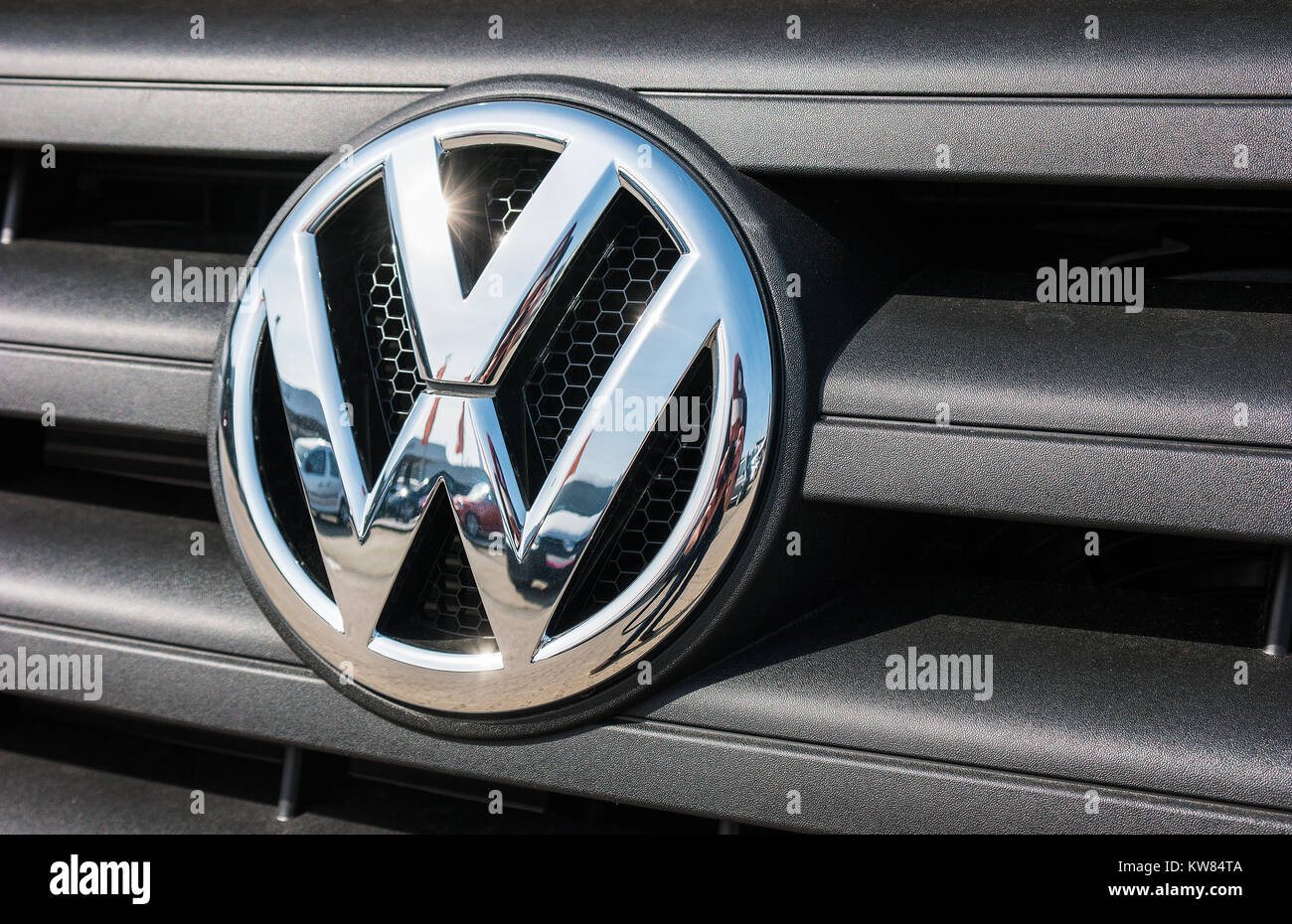 Volkswagen VW plate logo on a car grill. Volkswagen is a famous European car manufacturer company based on Germany. Stock Photo