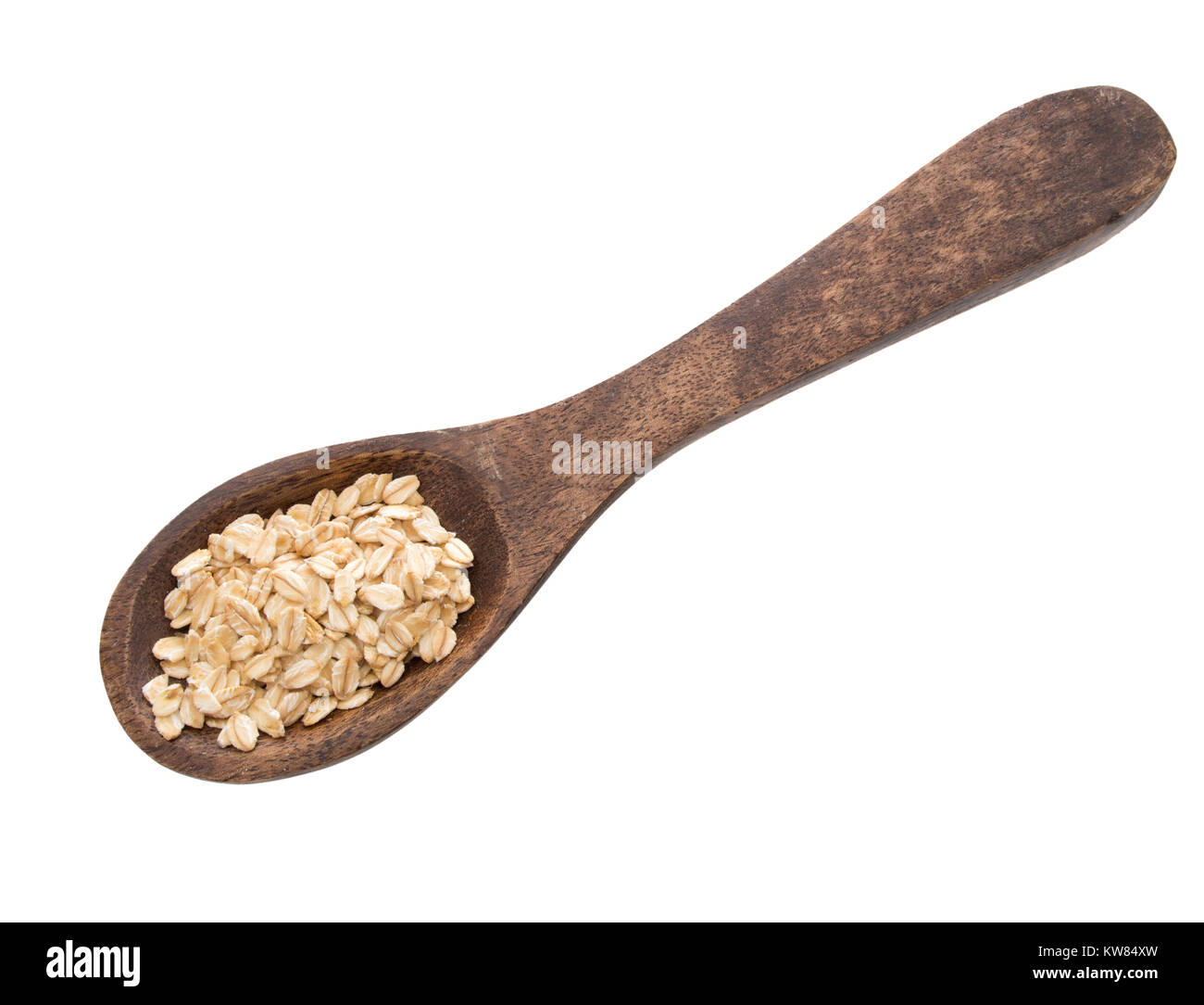 Spoon of organic whole grain oats, coarsely ground. Isolated on white. Stock Photo
