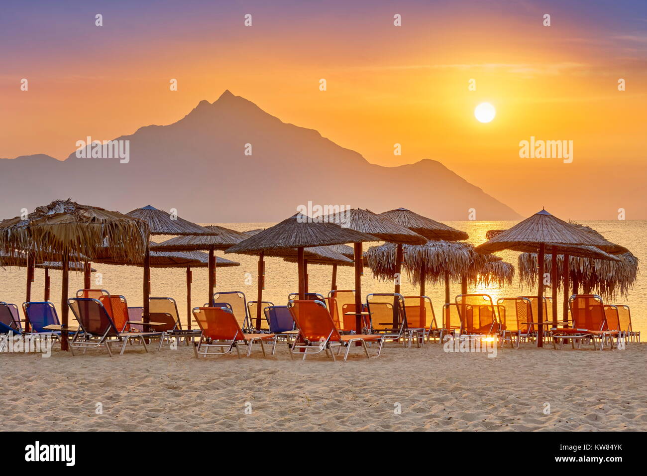 Sunrise at Halkidiki (or Chalkidiki) Beach, Mount Athos in the background, Greece Stock Photo