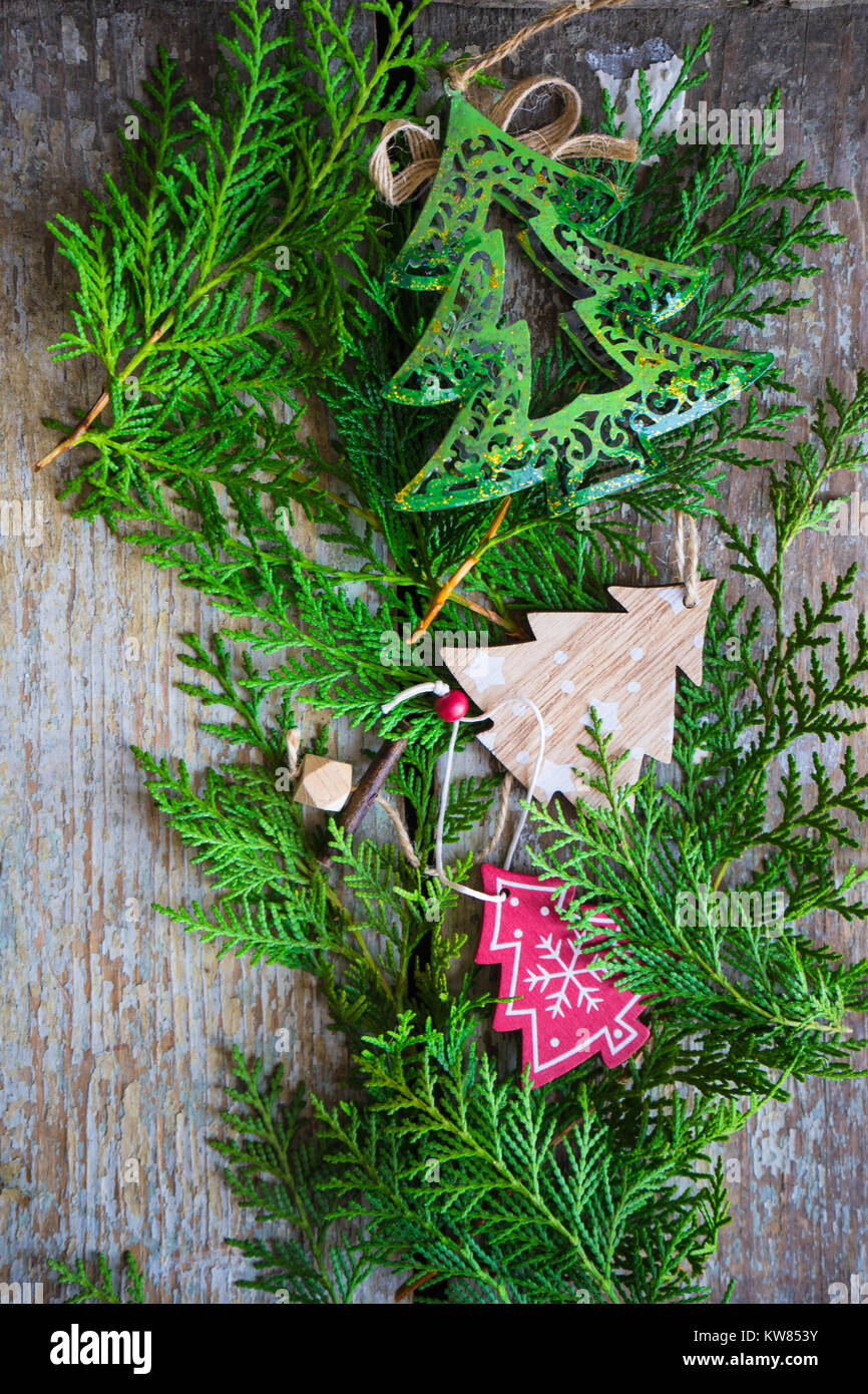 Christmas frame with fir tree branch, red berries and christmas tree ...