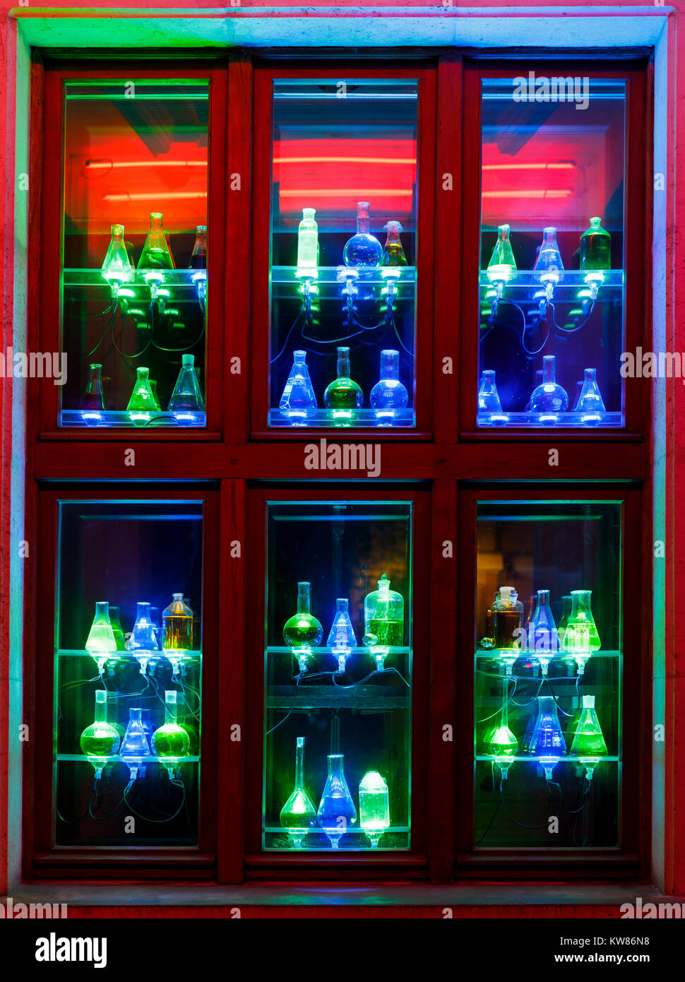 Many colorful illuminated bottles on window for decoration Stock Photo