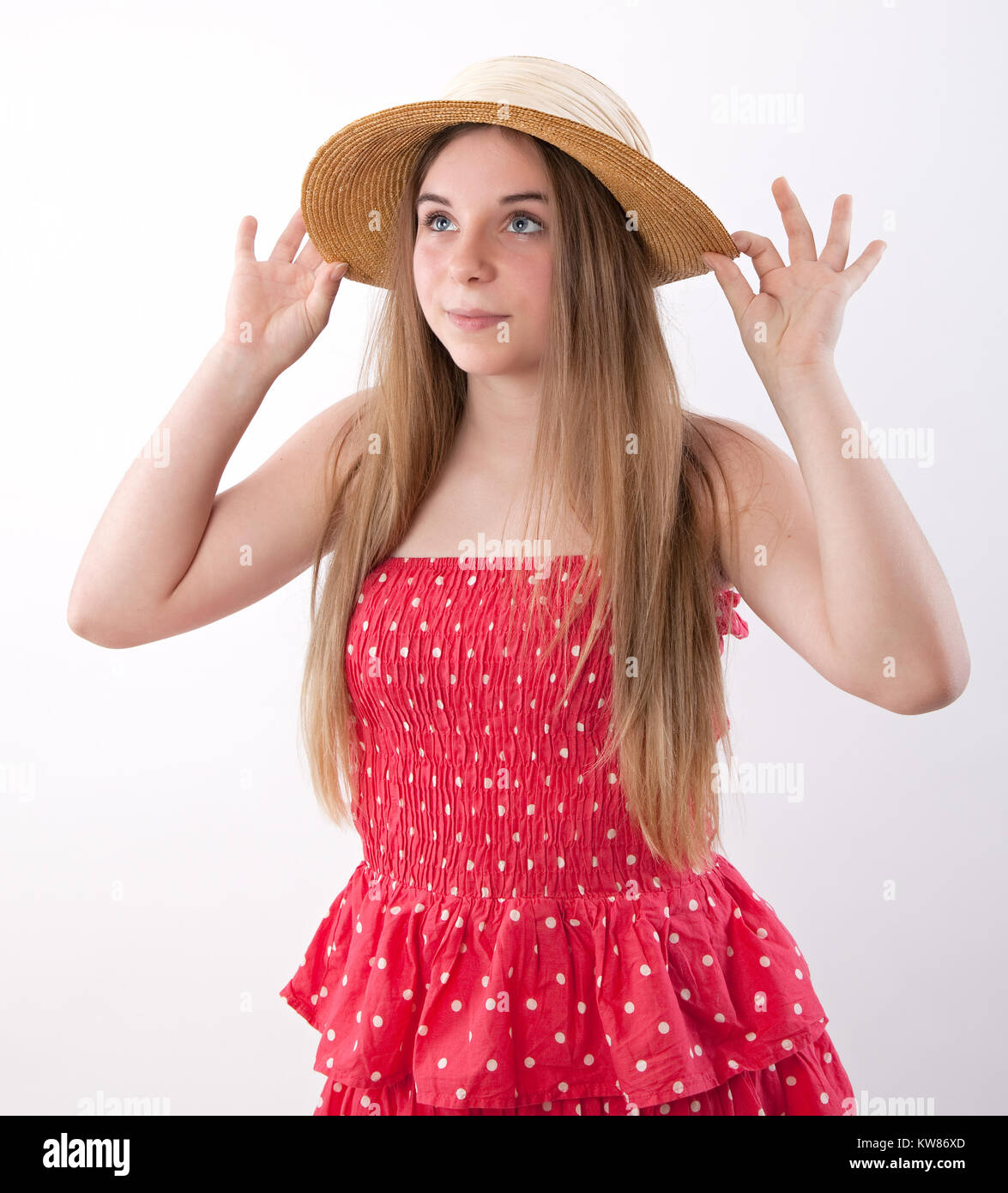 beautiful teenage girl in a red summer dress Stock Photo