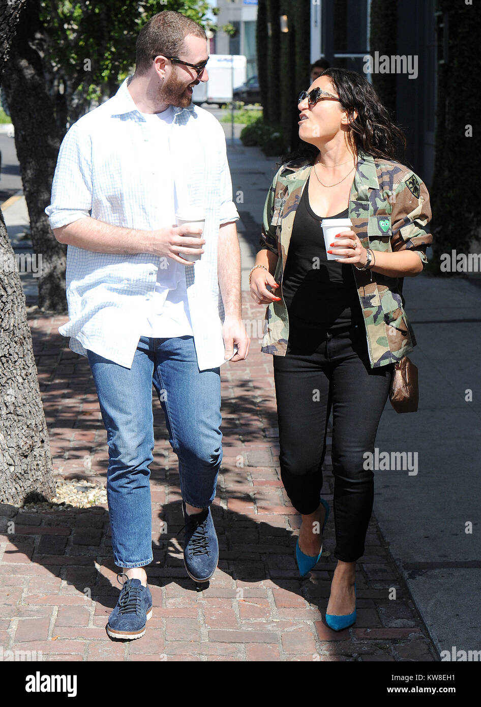 LOS ANGELES, CA - APRIL 25: Singer Sam Smith gets coffee with an  unidentified woman. Samuel Frederick "Sam" Smith is an English  singer-songwriter. He rose to fame in October 2012 when he