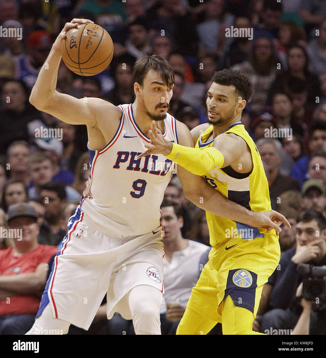 Denver, Colorado, USA. 30th Dec, 2017. 76ers DARIO SARIC, left, runs into Nuggets JAMAL MURRAY, right, during the 1st. Half at the Pepsi Center Saturday night. The 76ers beat the Nuggets 107-102. Credit: Hector Acevedo/ZUMA Wire/Alamy Live News Stock Photo