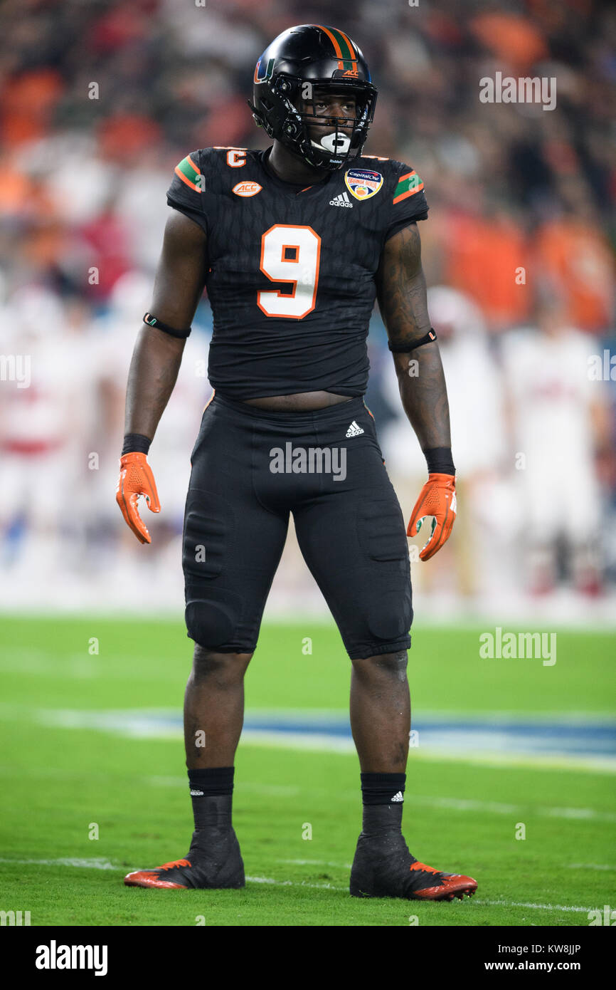 miami-hurricanes-defensive-lineman-chad-thomas-9-during-the-capital-one-orange-bowl-ncaa-college-football-bowl-game-between-wisconsin-and-miami-on-saturday-december-30-2017-at-hard-rock-stadium-in