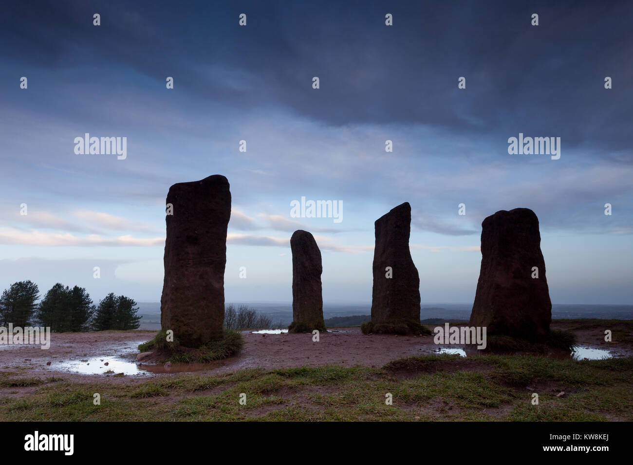 Clent, Worcestershire, UK. 31st December, 2017. On the last day of 2017, a gloomy dawn sky is pictured over the four stones in the Clent Hills, just southwest of Birmingham and the Black Country, UK.  Peter Lopeman/Alamy Live News Stock Photo