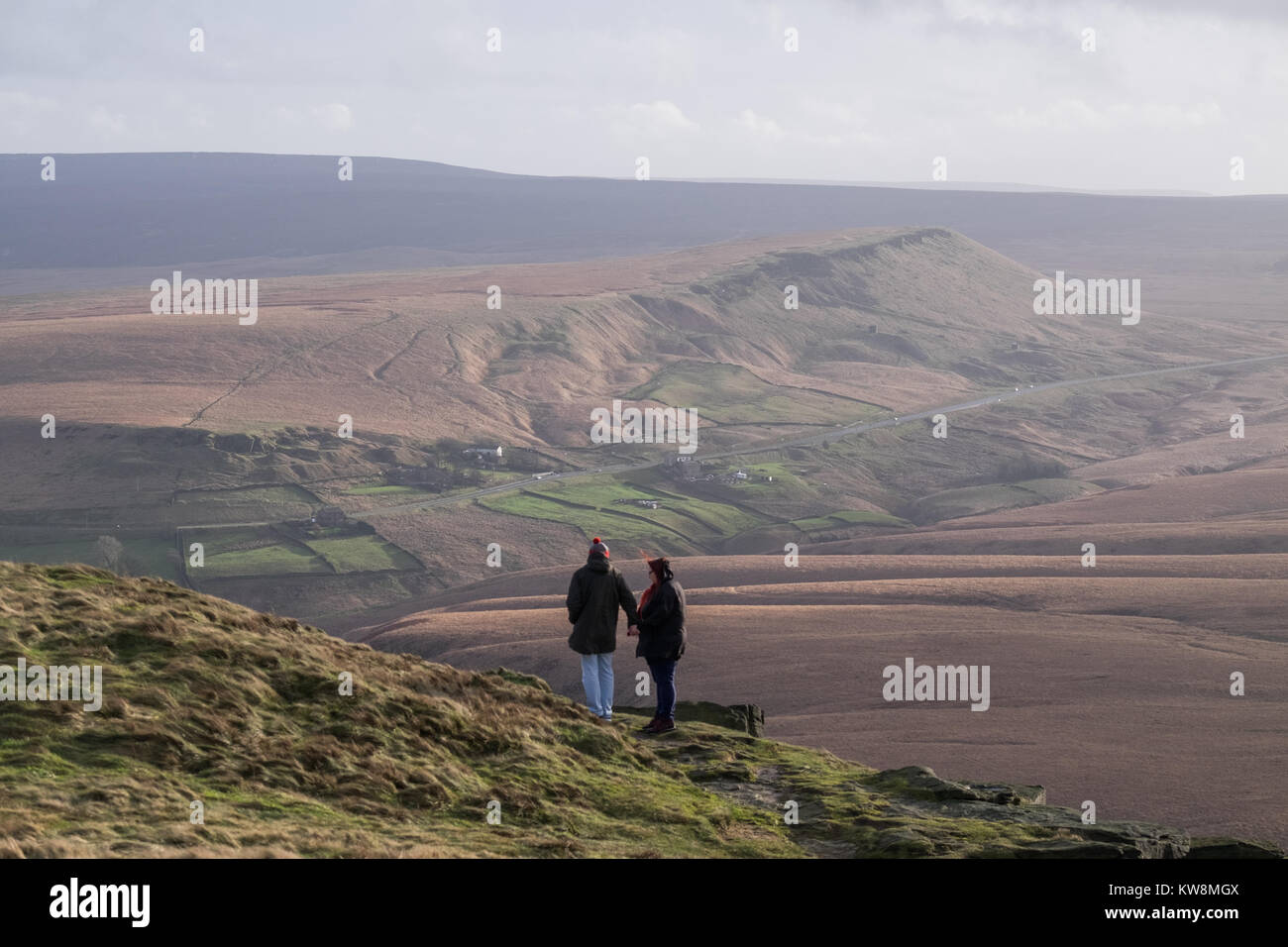 Buckstones, UK. 31st December, 2017. People enjoying the sunny but breezy weather in Buckstones overlooking the landscape of Marsden Moor and Pule Hill near Huddersfield on Sunday, December 31, 2017. © Christopher Middleton/Alamy Live News Stock Photo
