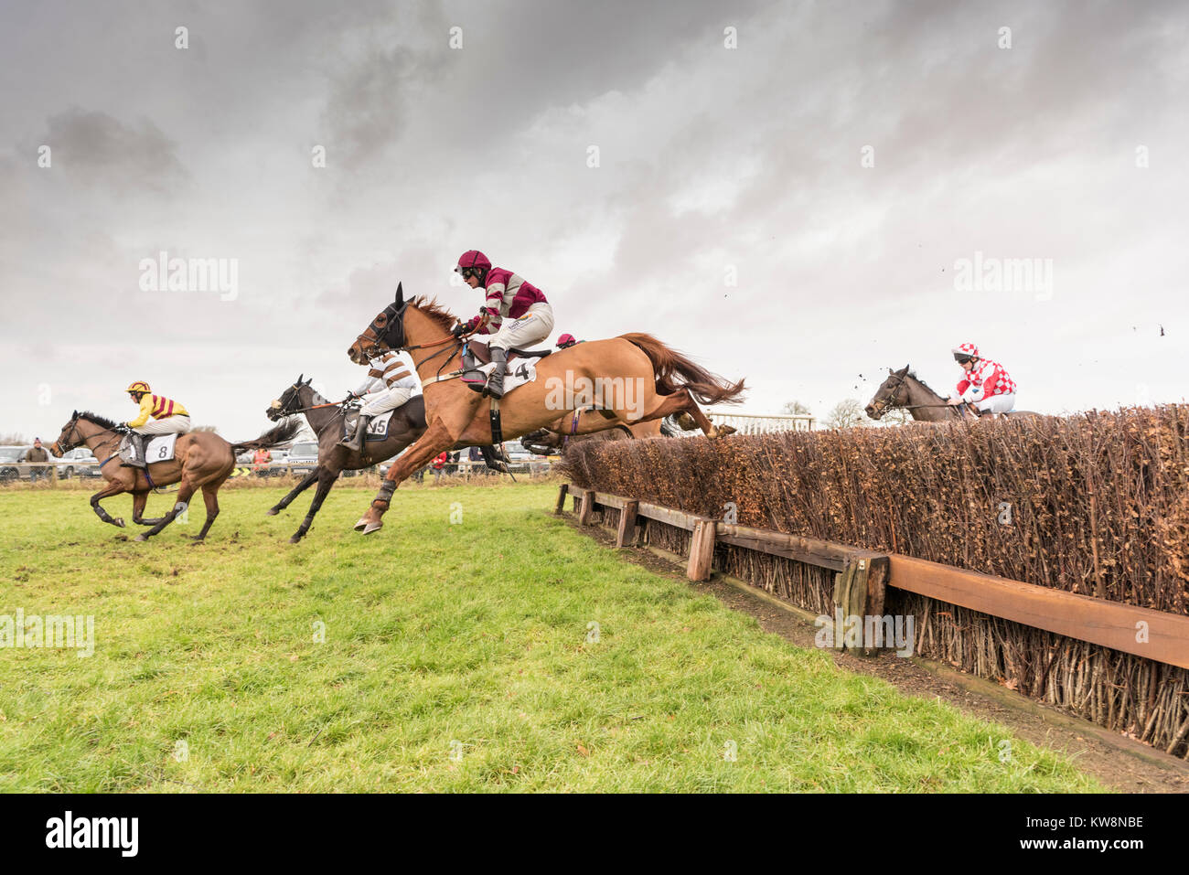 Cambridgeshire, UK. 31st December, 2017. Cottenham, Cambridgeshire UK 31st December 2017.   Runners and riders take part in the Cambridgeshire Harriers Hunt Club Point-to-Point Races.  The small, rural racecourse holds the traditional New Year’s Eve meeting each year where riders compete in horse racing over hurdles on hunting horses. Credit: Julian Eales/Alamy Live News Stock Photo