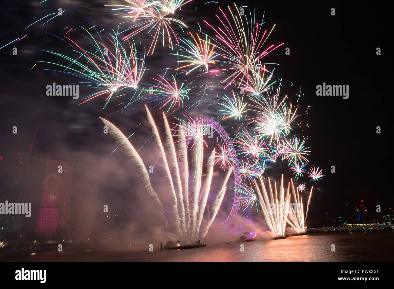 London, Britain. 1st Jan, 2018. Fireworks explode over the London Eye during the New Year celebrations in London, Britain, on Jan. 1, 2018. Credit: Ray Tang/Xinhua/Alamy Live News Stock Photo