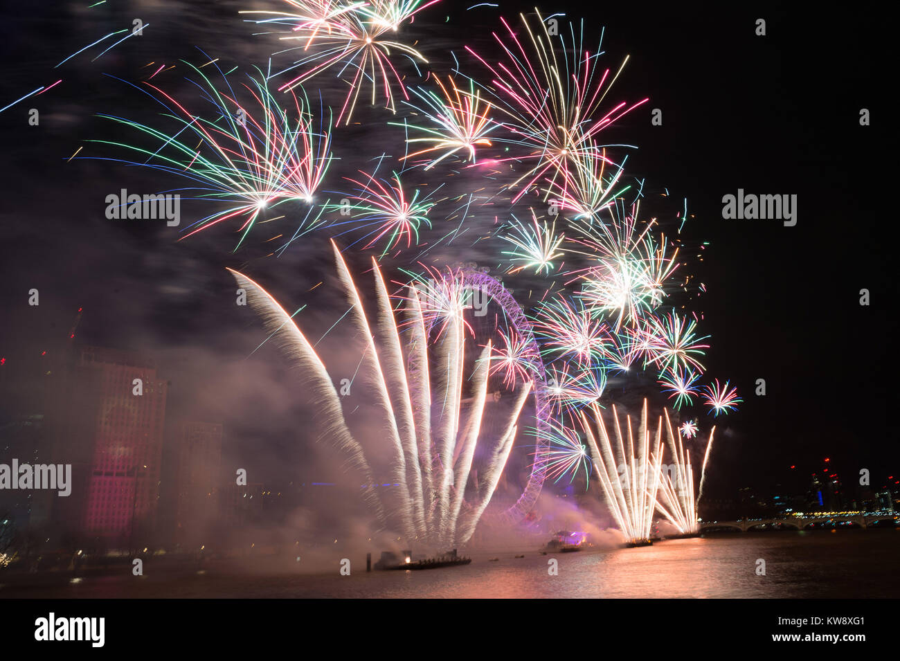 London, Britain. 1st Jan, 2018. Fireworks explode over the London Eye ...