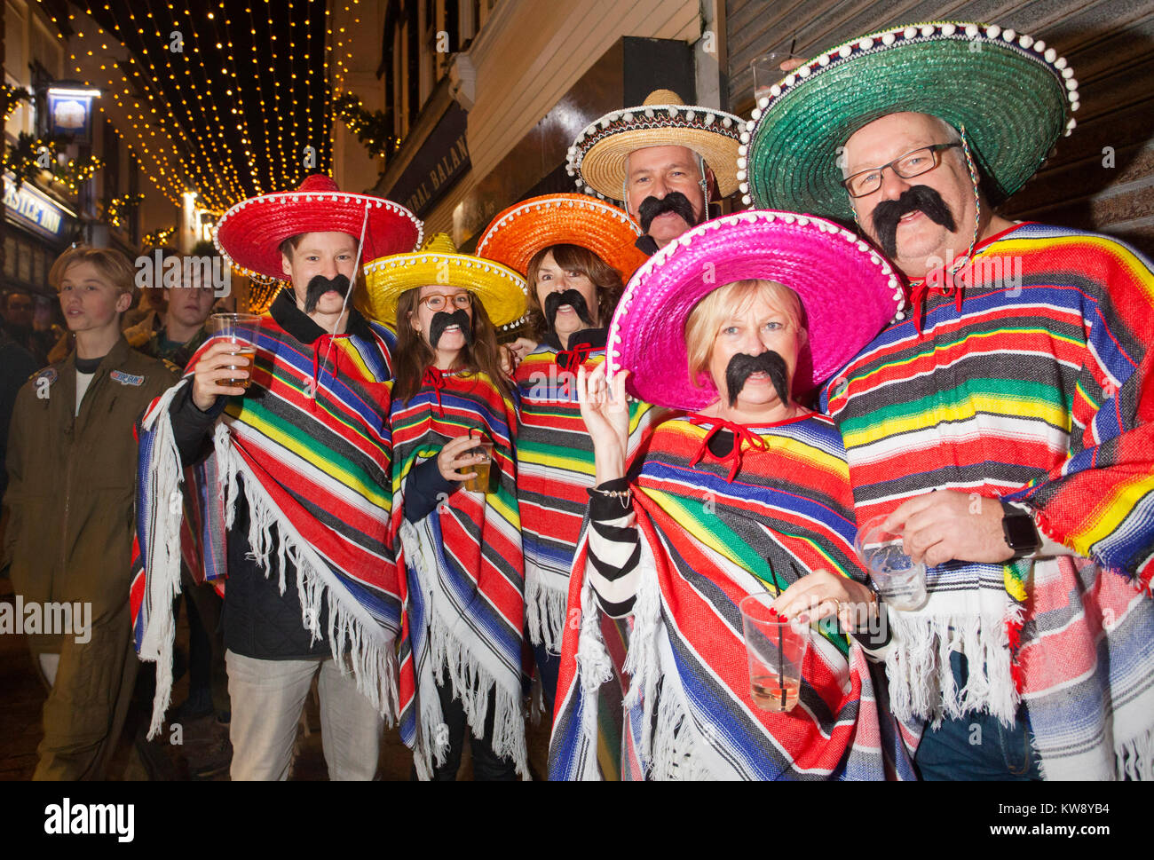 St Ives, Cornwall, UK, New Year's Eve, 2017. Party goers flood the streets of the Cornish fishing village in fancy dress for the New Year's Eve celebrations. Credit: Mike Newman/Alamy Live News Stock Photo