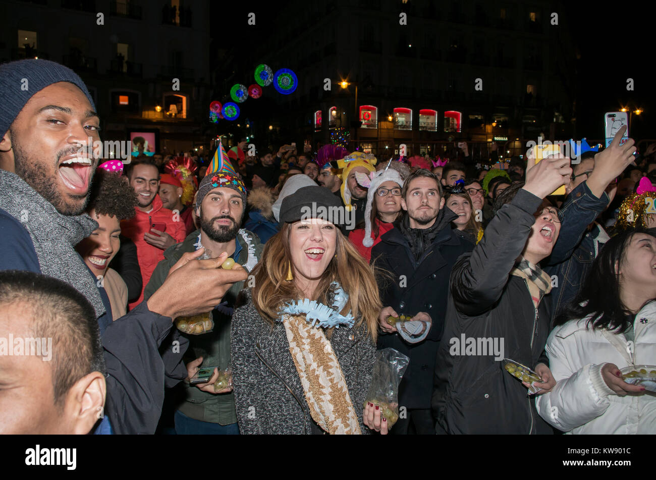Madrid, Spain. 31st Dec, 2017. Thousands of people gathered at the central square of Madrid Puerta del Sol to welcome the new year and have the traitional 12 lucky grapes. Credit: Lora Grigorova/Alamy Live News Stock Photo