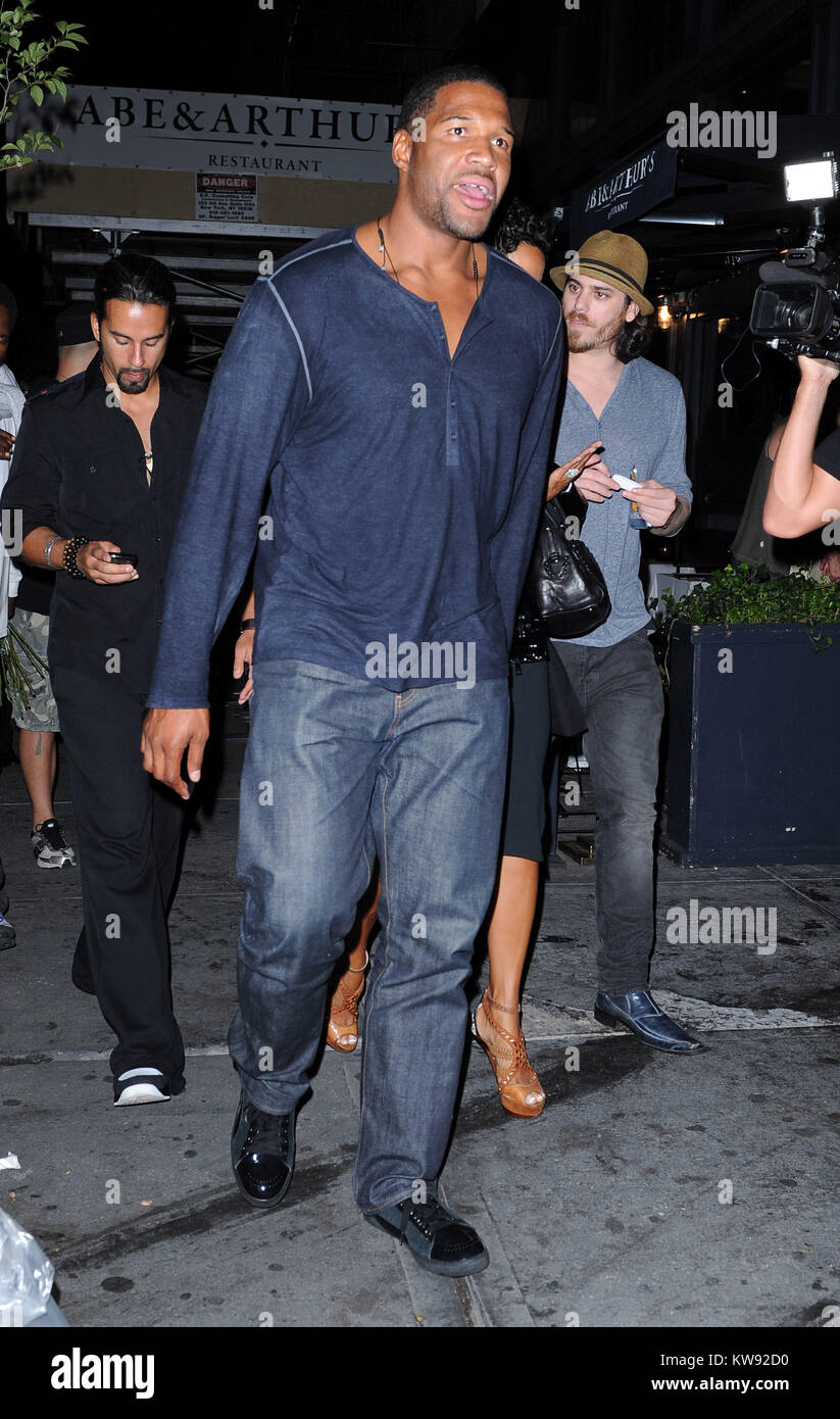NEW YORK, NY - SEPTEMBER 08: Michael Strahan and fiance Nicole Murphy with a huge cut on her leg exit Abe and Arthurs in the meatpacking district. on September 2011 in