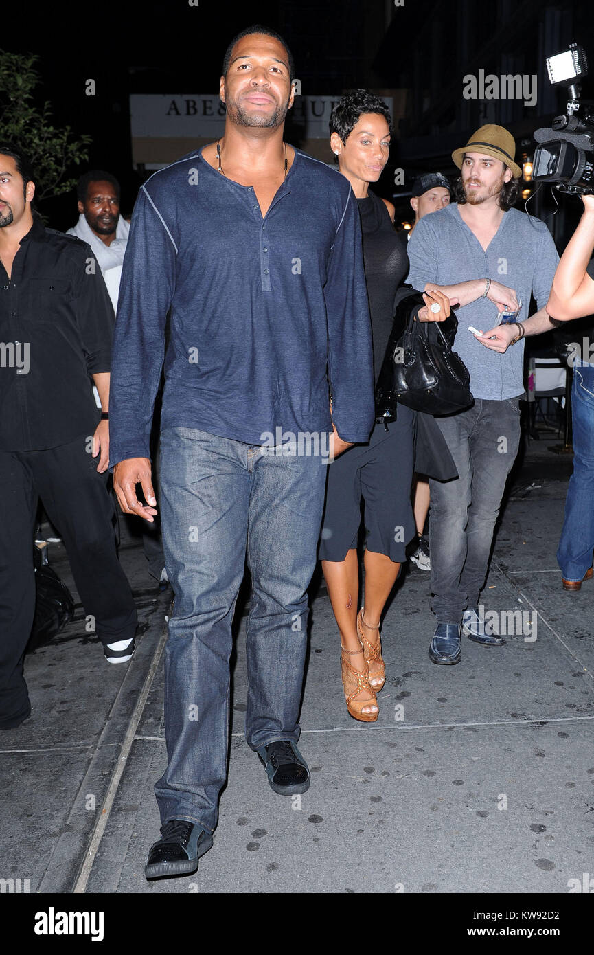 NEW YORK, NY - SEPTEMBER 08: Michael Strahan and fiance Nicole Murphy with  a huge cut on her leg exit Abe and Arthurs in the meatpacking district. on  September 8, 2011 in
