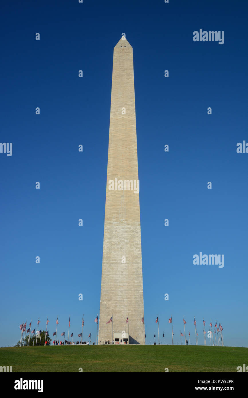 Portrait orientation of the Washington Monument white marble obelisk at the National Mall, Washington DC, USA on bright sunny clear day with blue sky Stock Photo