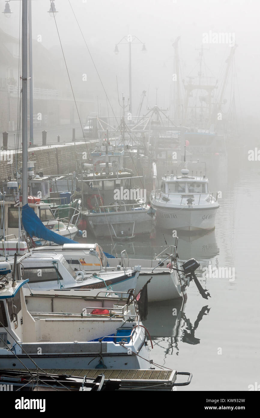 Misty morning in the harbour at Port-en-Bessin, Normandy Stock Photo