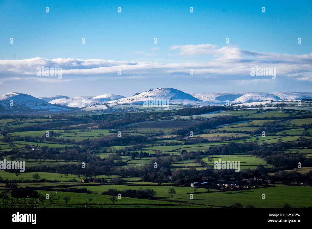 Snow covered mountains of Caer Caradoc and the Long Mynd that overlook