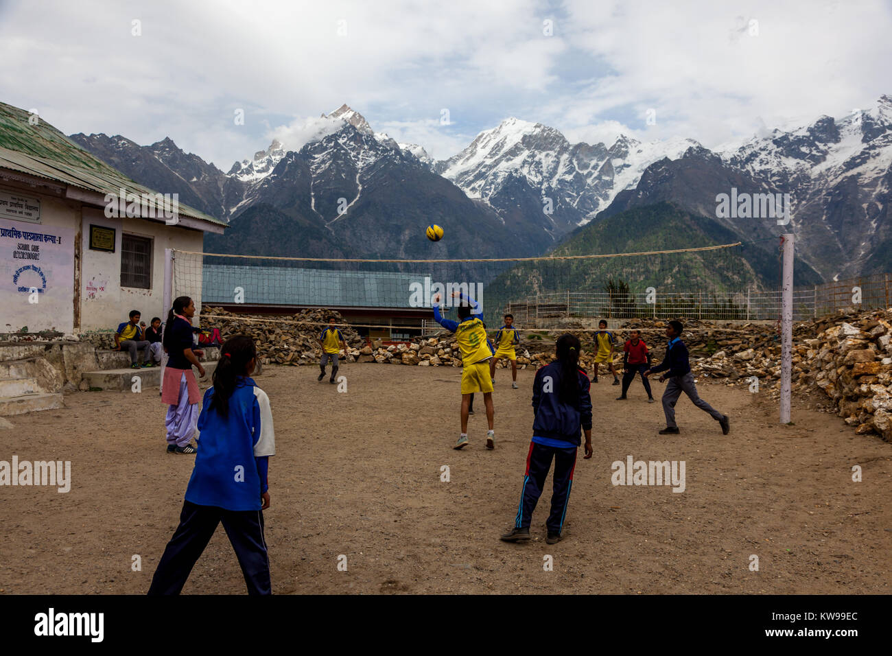 School children playing volleyball in school premise at Kalpa, Himachal